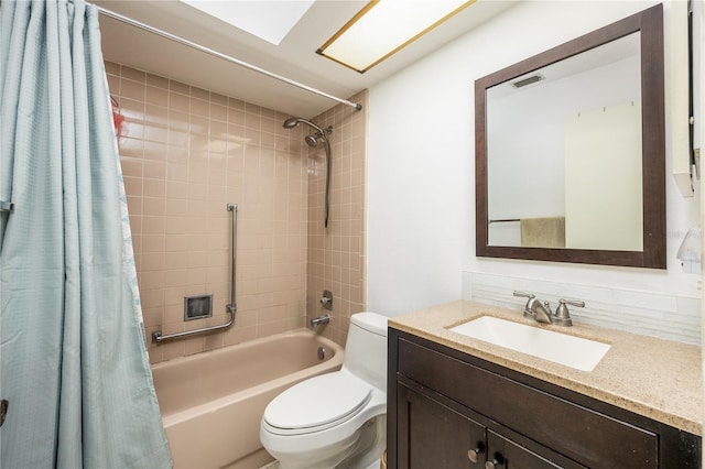 full bathroom featuring decorative backsplash, vanity, shower / bath combo, and toilet