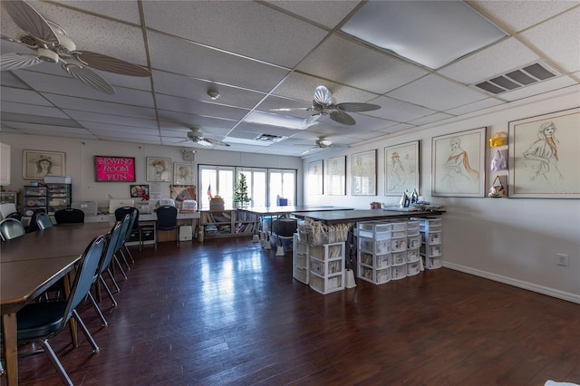 interior space featuring dark hardwood / wood-style flooring and a paneled ceiling