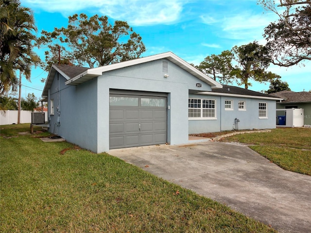 single story home with central AC unit, a garage, and a front lawn