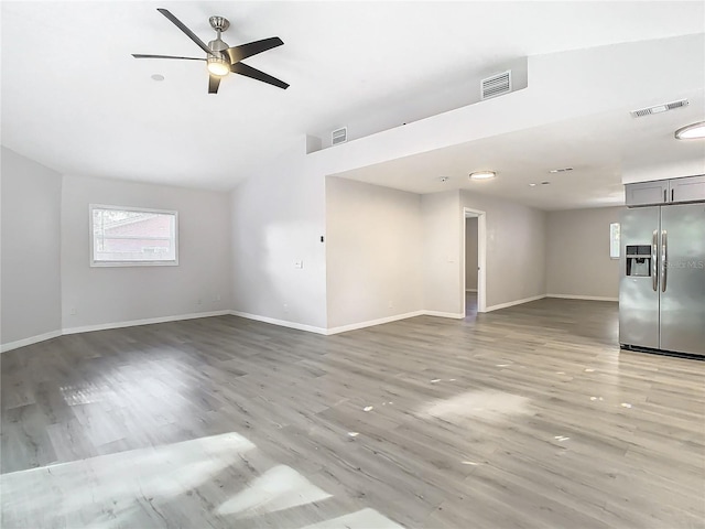 unfurnished living room with hardwood / wood-style flooring and ceiling fan