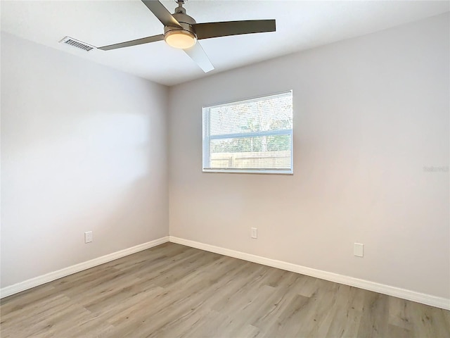 spare room featuring ceiling fan and light hardwood / wood-style floors