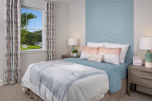 bedroom featuring light colored carpet