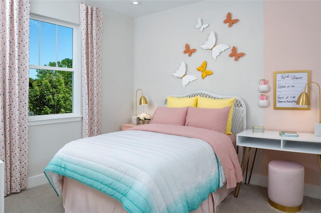 bedroom with light colored carpet