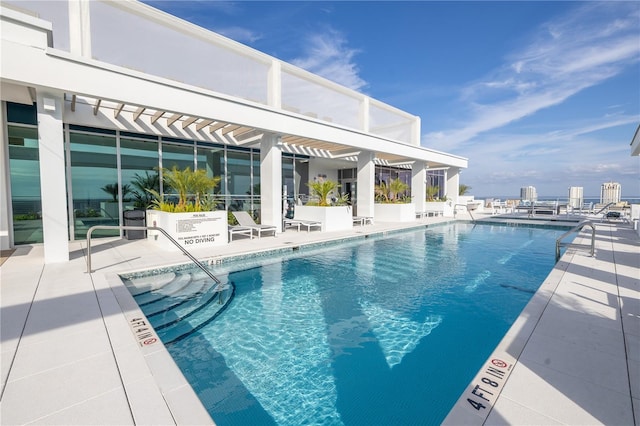 view of pool featuring a patio