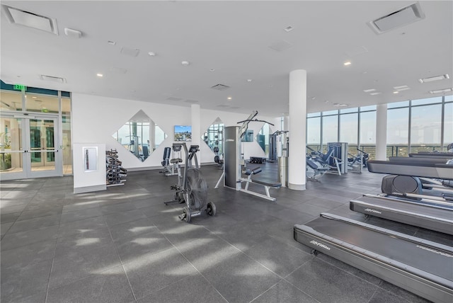 exercise room with floor to ceiling windows