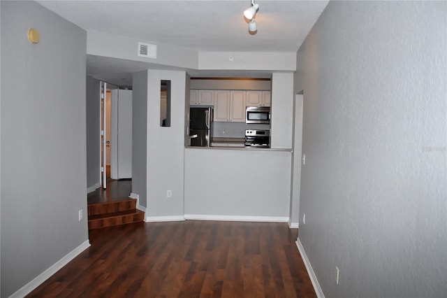 hallway with dark wood-type flooring