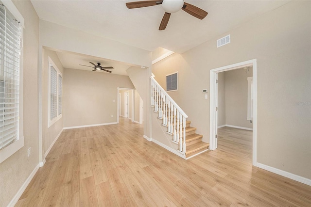 interior space with ceiling fan and light hardwood / wood-style flooring