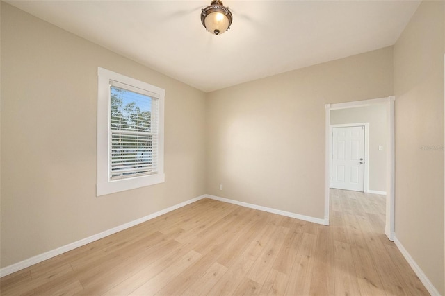 spare room featuring light hardwood / wood-style floors