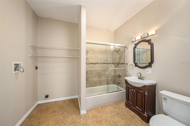 full bathroom with tile patterned flooring, vanity, toilet, and shower / bath combination with glass door