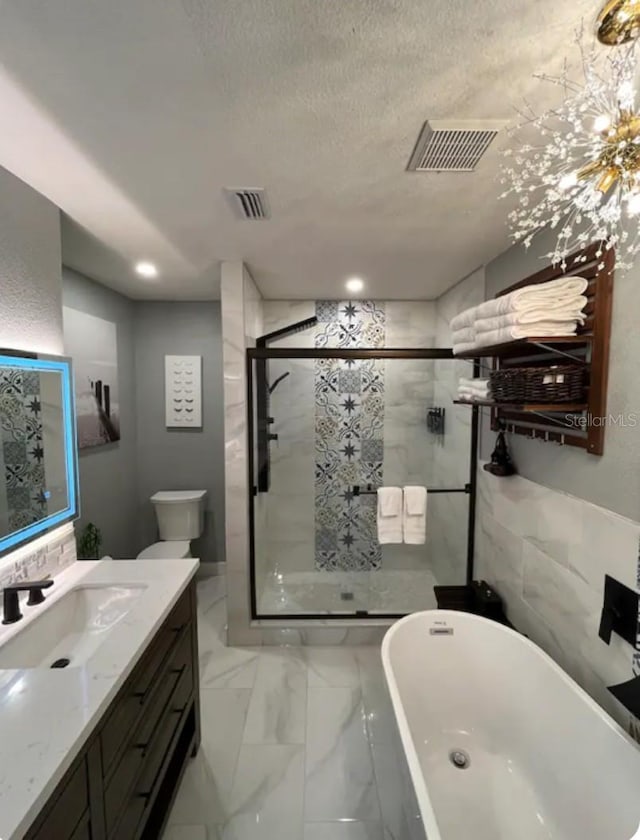 bathroom featuring vanity, plus walk in shower, and a textured ceiling