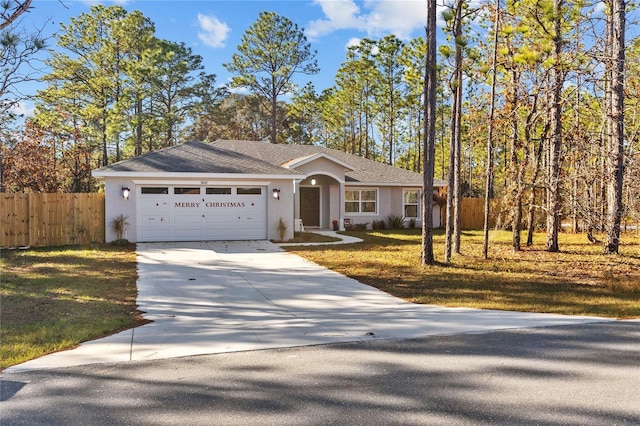 ranch-style home with a garage and a front lawn