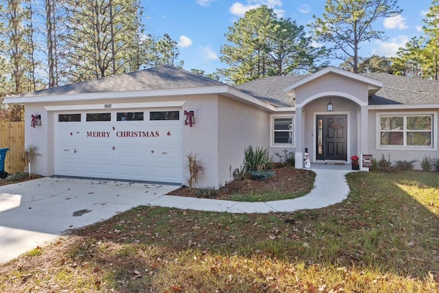 single story home featuring a garage