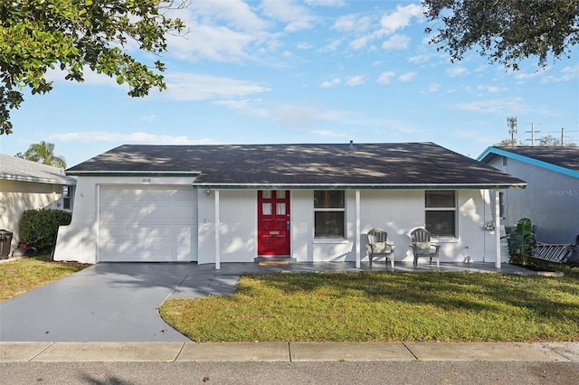 single story home featuring a front yard and a garage