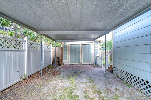 view of patio featuring a storage unit