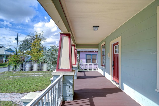 wooden terrace featuring a porch