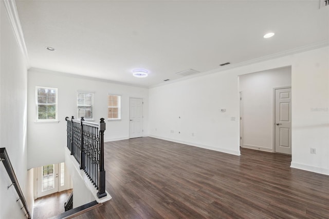 unfurnished room with dark wood-type flooring and ornamental molding