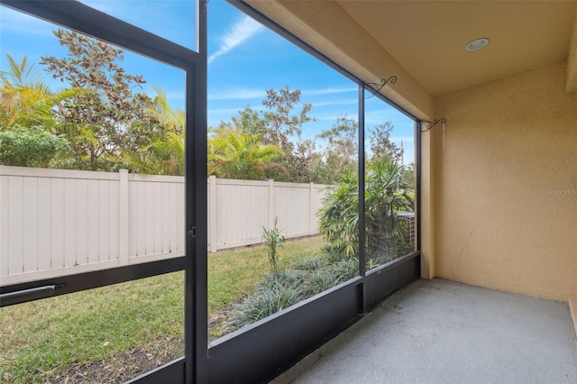 unfurnished sunroom featuring a wealth of natural light