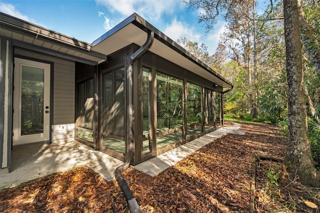 exterior space featuring a sunroom