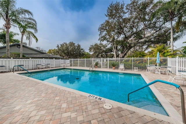 view of pool featuring a patio area