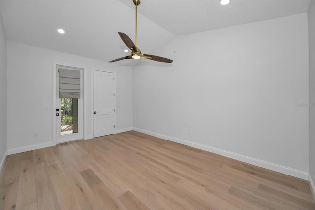 unfurnished room featuring ceiling fan, light hardwood / wood-style floors, and lofted ceiling