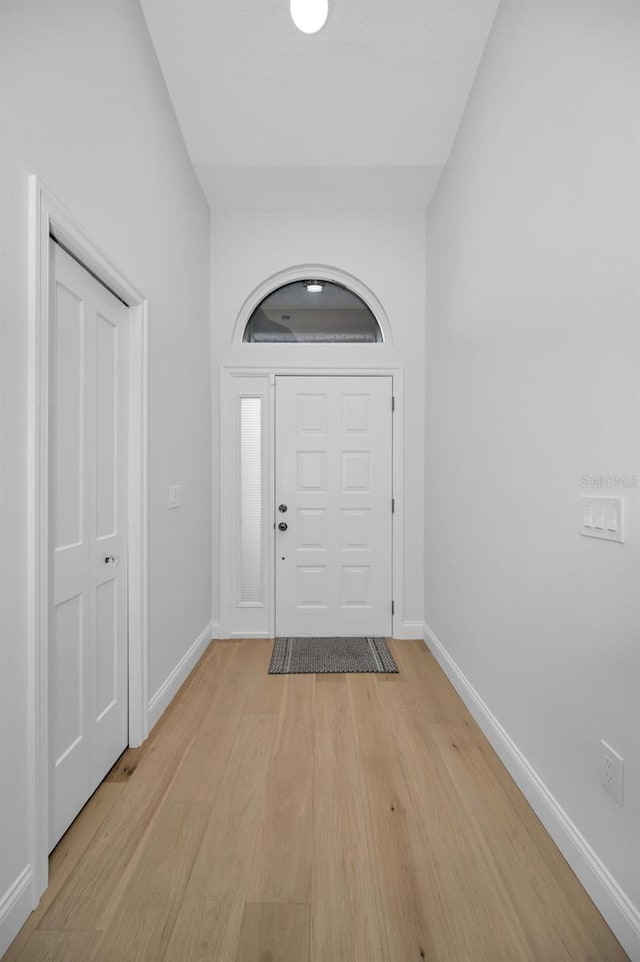 foyer entrance with light hardwood / wood-style floors