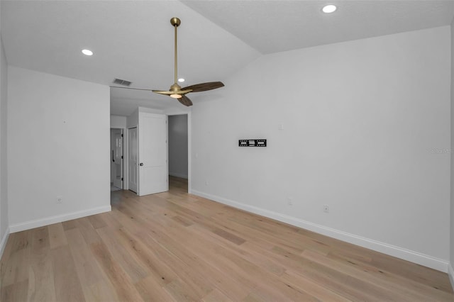 unfurnished bedroom featuring a textured ceiling, ceiling fan, light hardwood / wood-style flooring, and vaulted ceiling