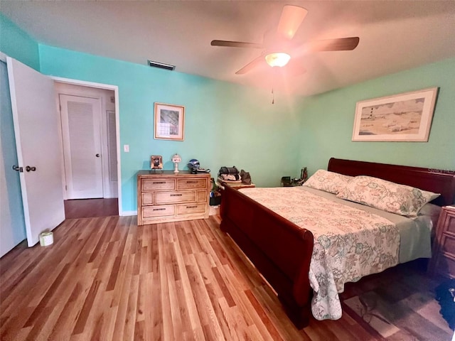 bedroom featuring ceiling fan and light hardwood / wood-style flooring