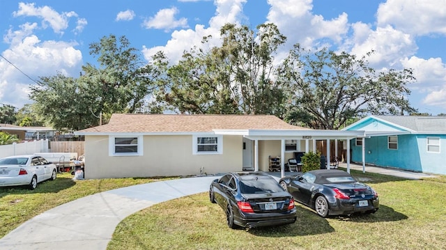 single story home with a front lawn