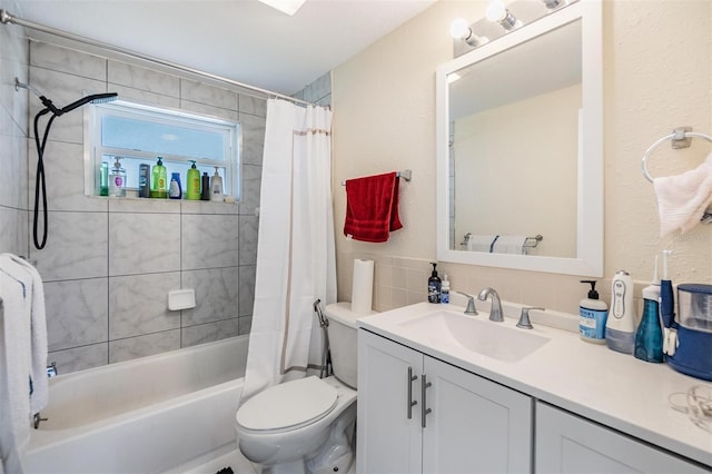 full bathroom with vanity, toilet, and shower / bath combo with shower curtain