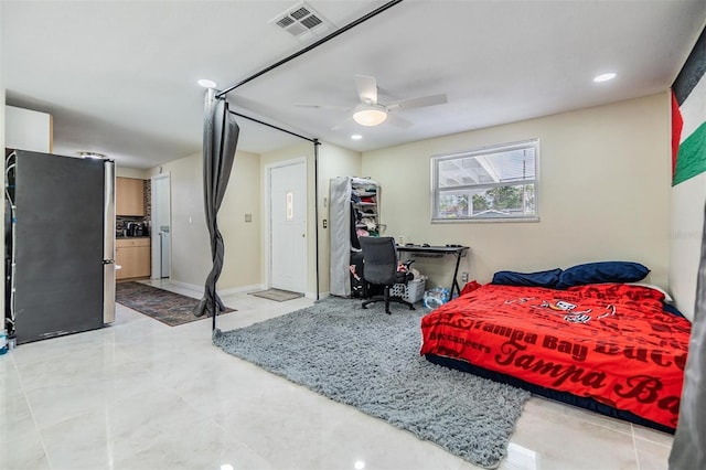 bedroom with stainless steel fridge and ceiling fan