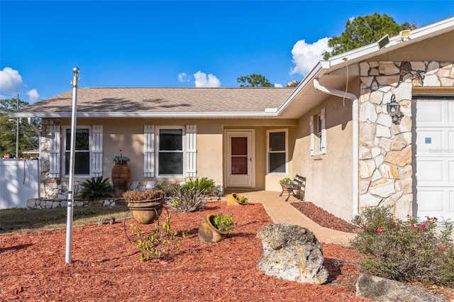 view of exterior entry featuring a garage