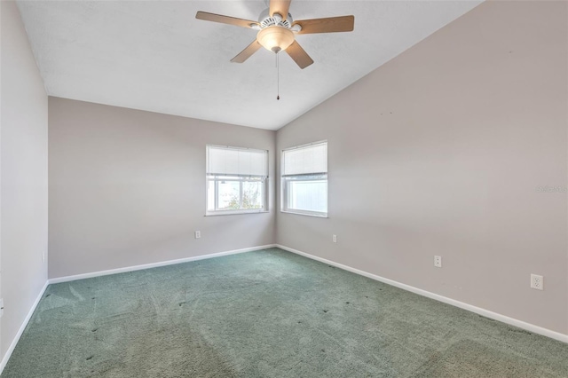 empty room featuring carpet flooring, ceiling fan, and lofted ceiling