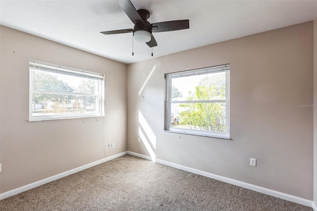 carpeted empty room with ceiling fan