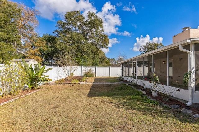 view of yard featuring a sunroom