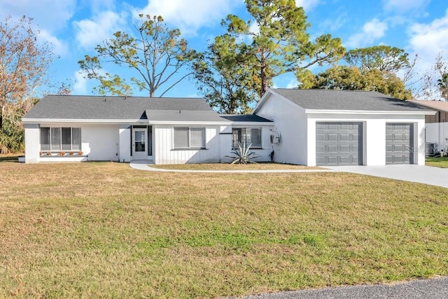 ranch-style house with central air condition unit, a front yard, and a garage