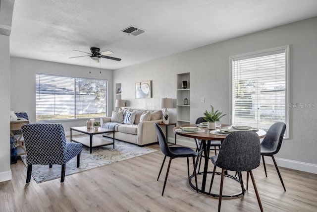 dining area featuring ceiling fan and light hardwood / wood-style floors