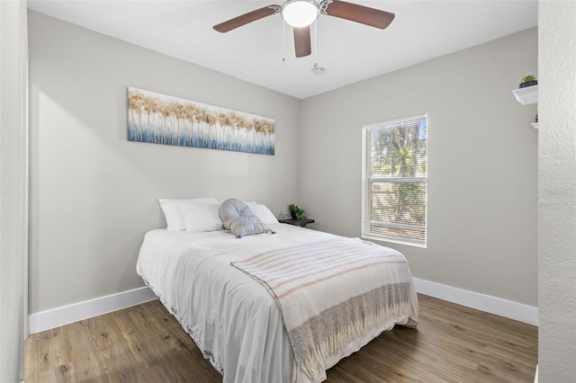 bedroom featuring ceiling fan and wood-type flooring