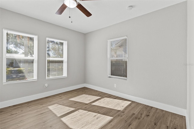 unfurnished room with ceiling fan and light hardwood / wood-style floors