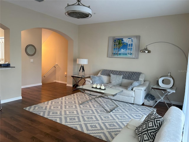 living room featuring dark wood-type flooring