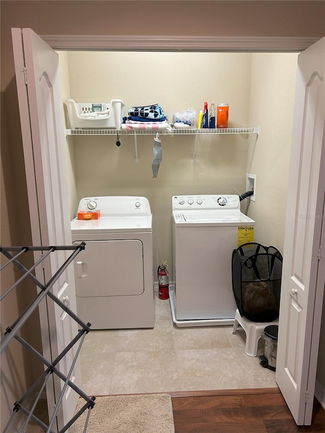 laundry room with separate washer and dryer