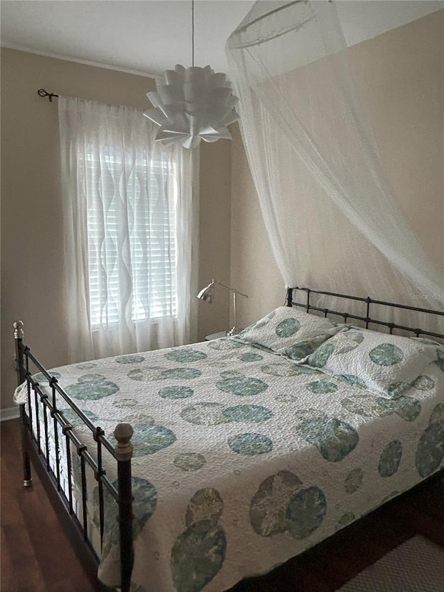 bedroom featuring dark wood-type flooring