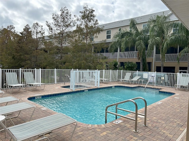 view of swimming pool with a patio