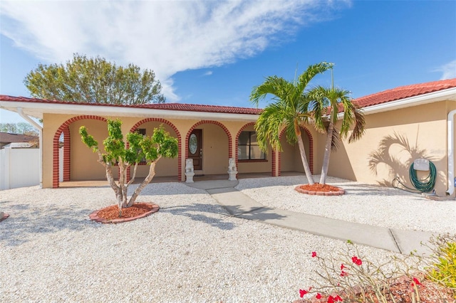 mediterranean / spanish-style house with covered porch