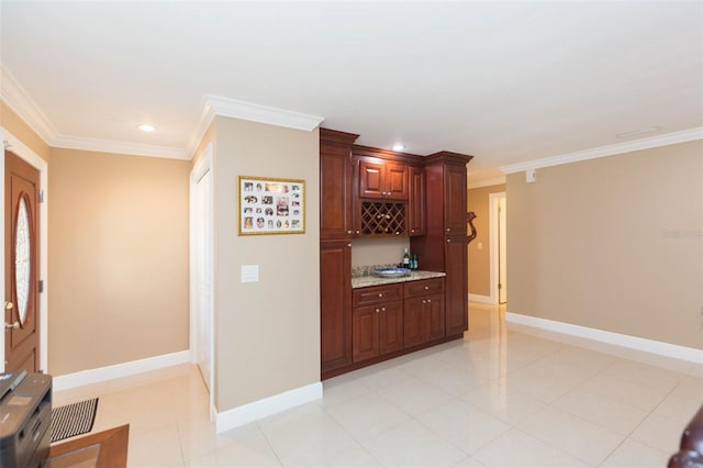 bar featuring light stone countertops, light tile patterned floors, and crown molding