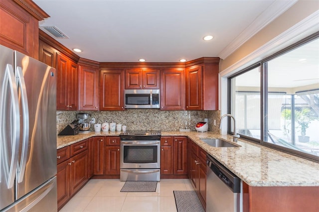 kitchen with light stone countertops, stainless steel appliances, crown molding, sink, and light tile patterned flooring