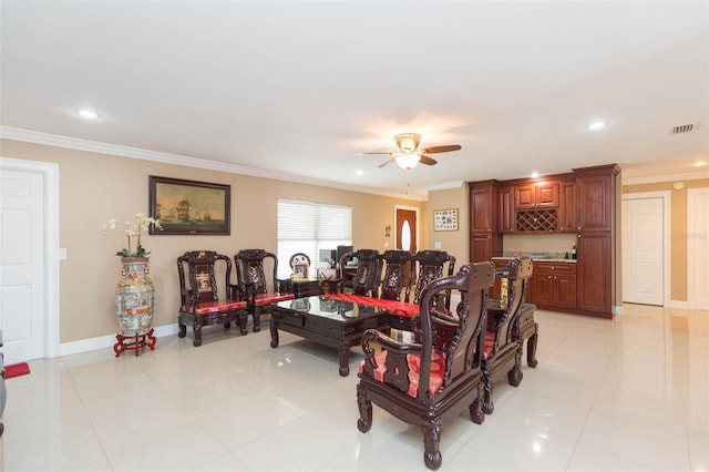 tiled living room with crown molding and ceiling fan