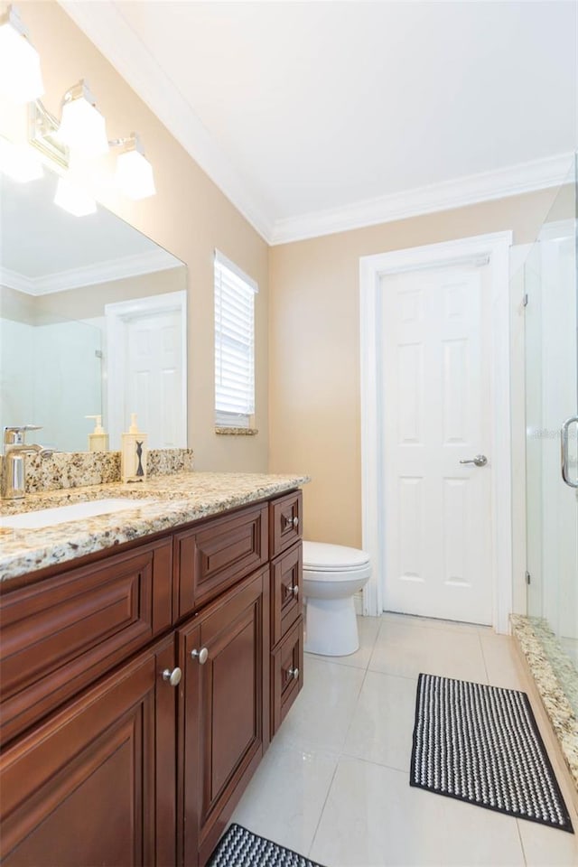 bathroom with an enclosed shower, vanity, crown molding, tile patterned flooring, and toilet