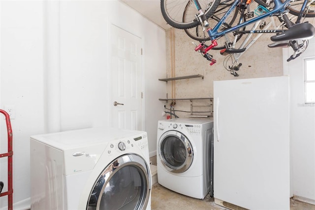 laundry room with washer and clothes dryer