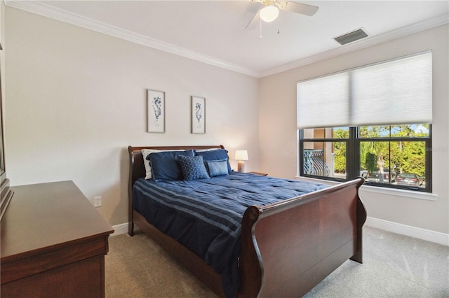 bedroom with carpet, ceiling fan, and ornamental molding