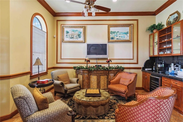 living area with bar, beverage cooler, ornamental molding, and ceiling fan